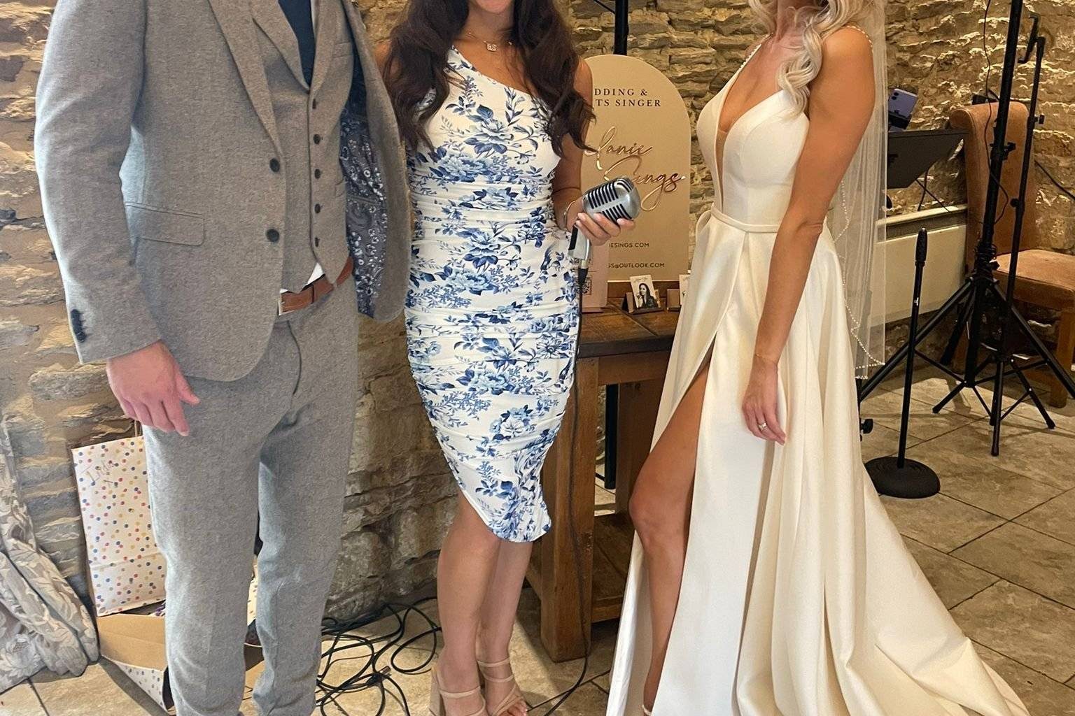 Melanie with a bride and groom at their wedding